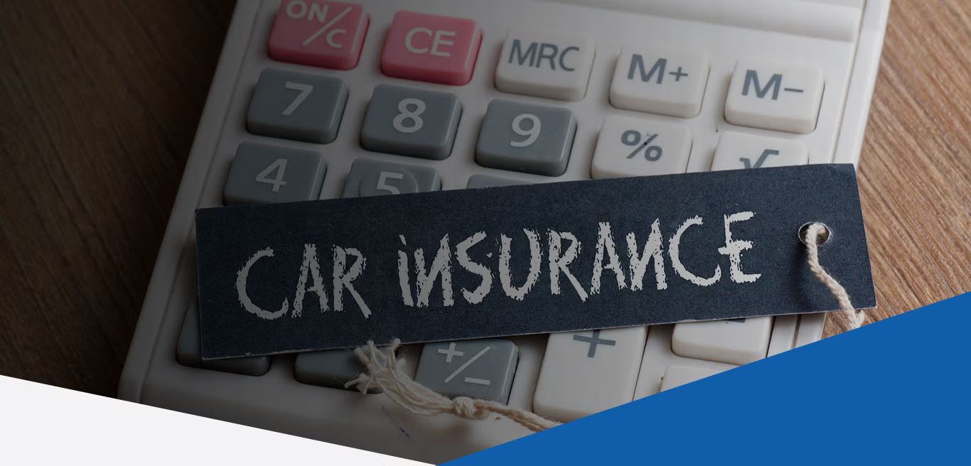 A car insurance document and a calculator