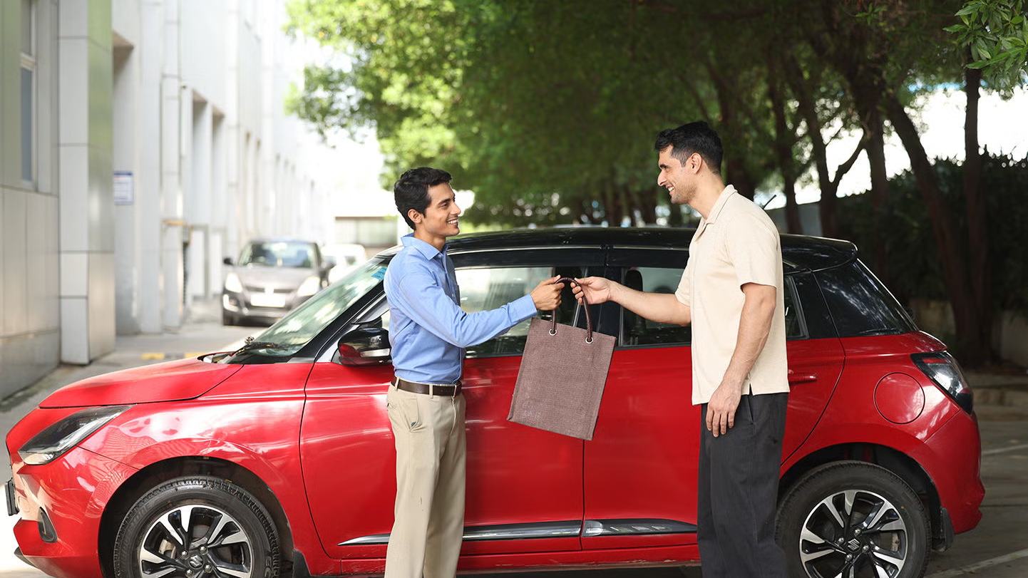 A customer being handed the keys to a new Maruti Suzuki
